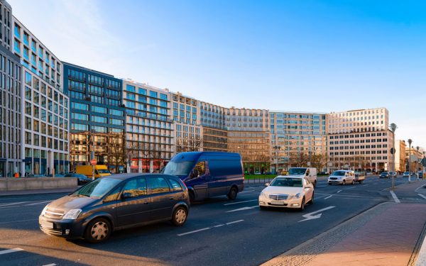 Street with car traffic and modern architecture on Potsdamer Platz reflex
