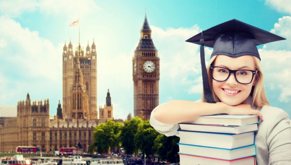 student in trencher cap with books over london