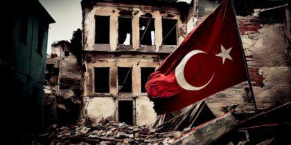 Destroyed house after earthquake with turkey flags
