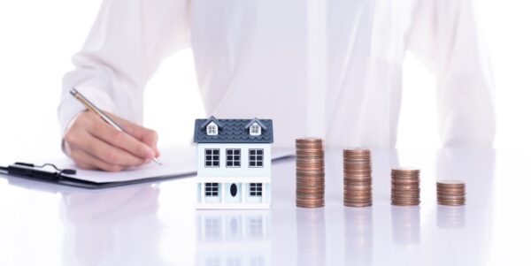 Hand separate saving money, finance, loan, debt into two stack c