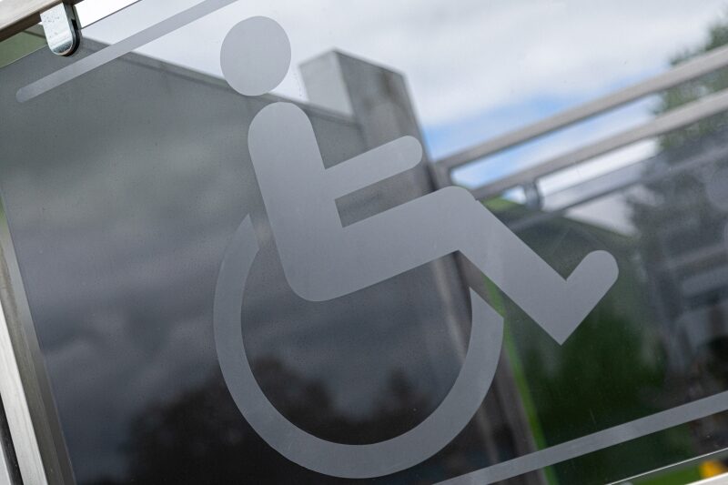 Close-up of sign physically handicapped person in wheelchair
