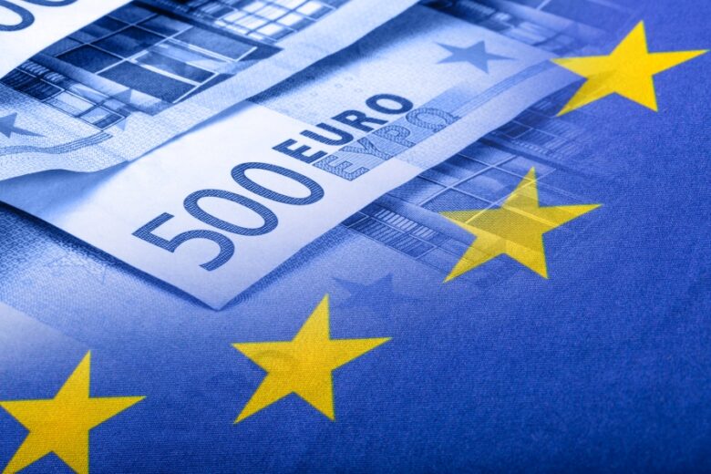 Euro flag. Euro money. Euro currency. Colorful waving european union flag on a euro money background