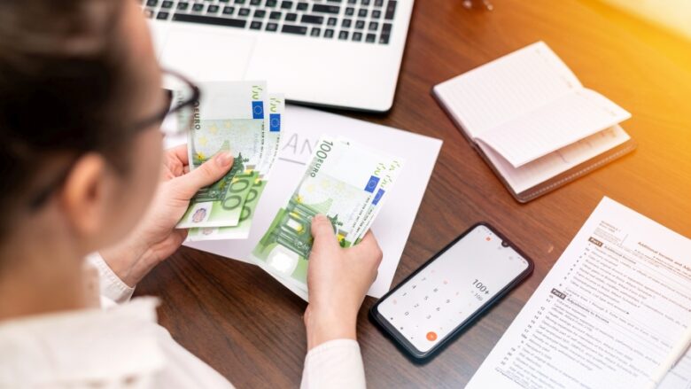 Woman working with finances on the table