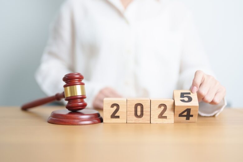 2024 end year to Happy New Year 2025 with judge gavel on table. Law, lawyer, judgment, justice auction and bidding concept